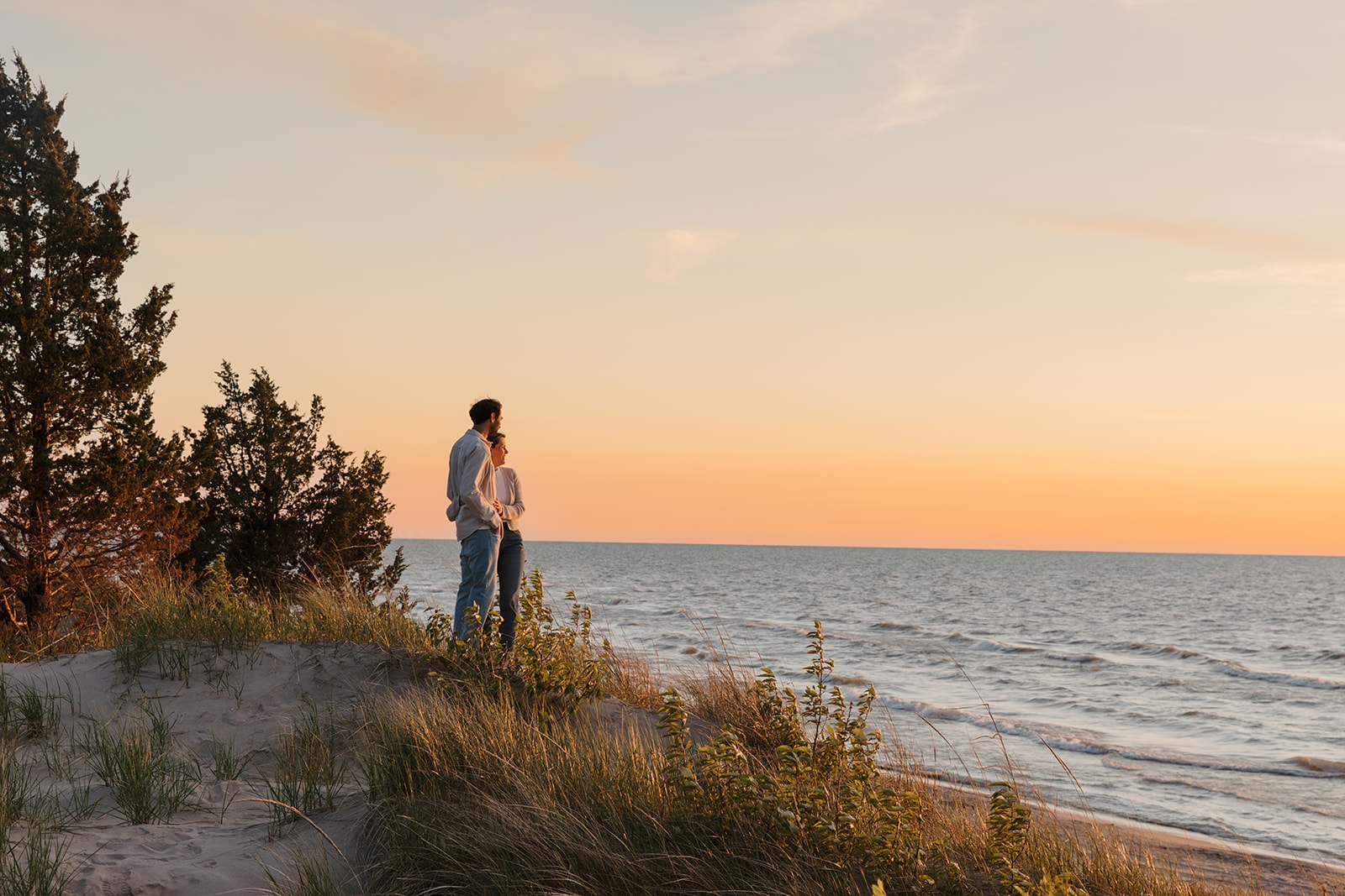 Sarah and Stephane looking over the lake at sunset.